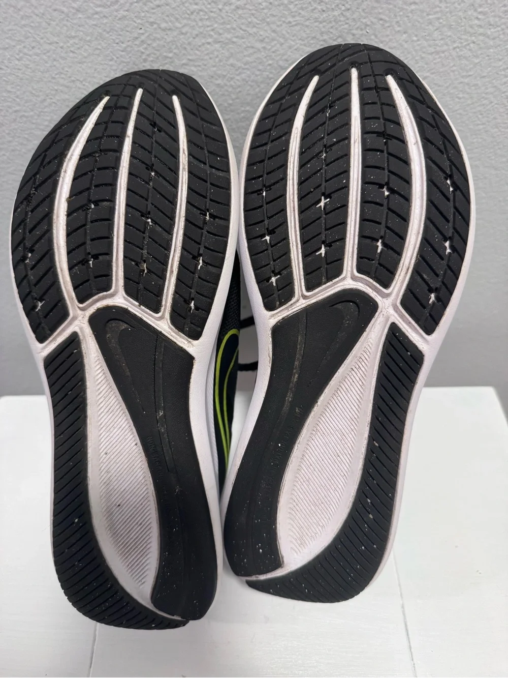 Nike Black Sneakers with Neon Yellow Swoosh and White Sole